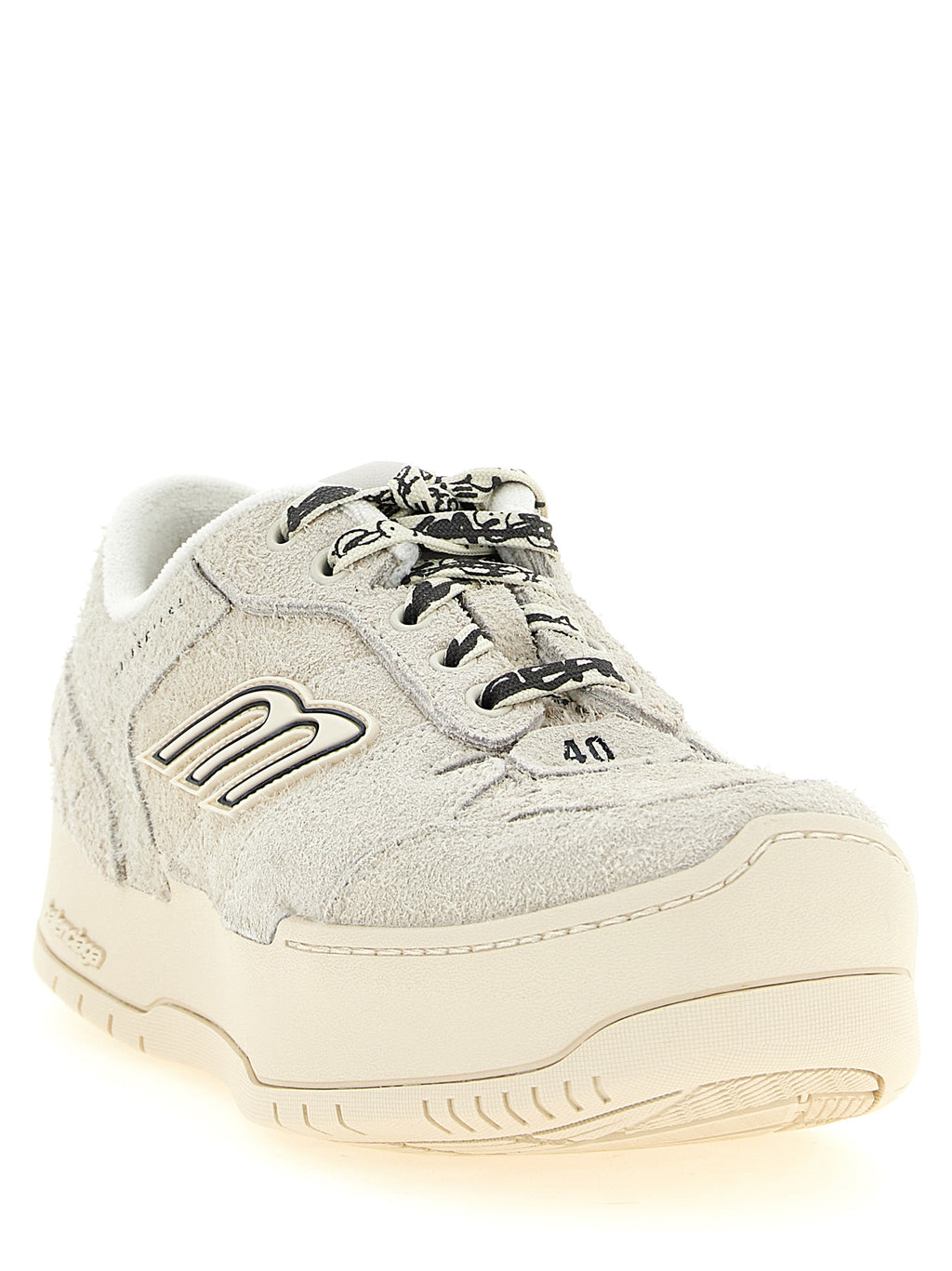 Sneakers plateforme en cuir de bovin beige de la marque Balenciaga, vue de face avec détails du design.