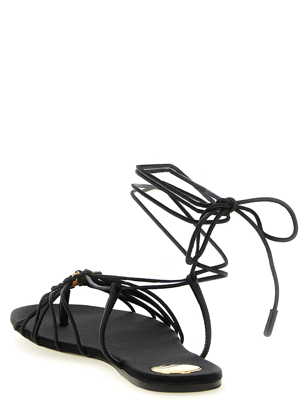 Sandales plates en cuir de agneau noir de la marque Saint Laurent, visibles avec détails en cuir lisse et semelle fine.