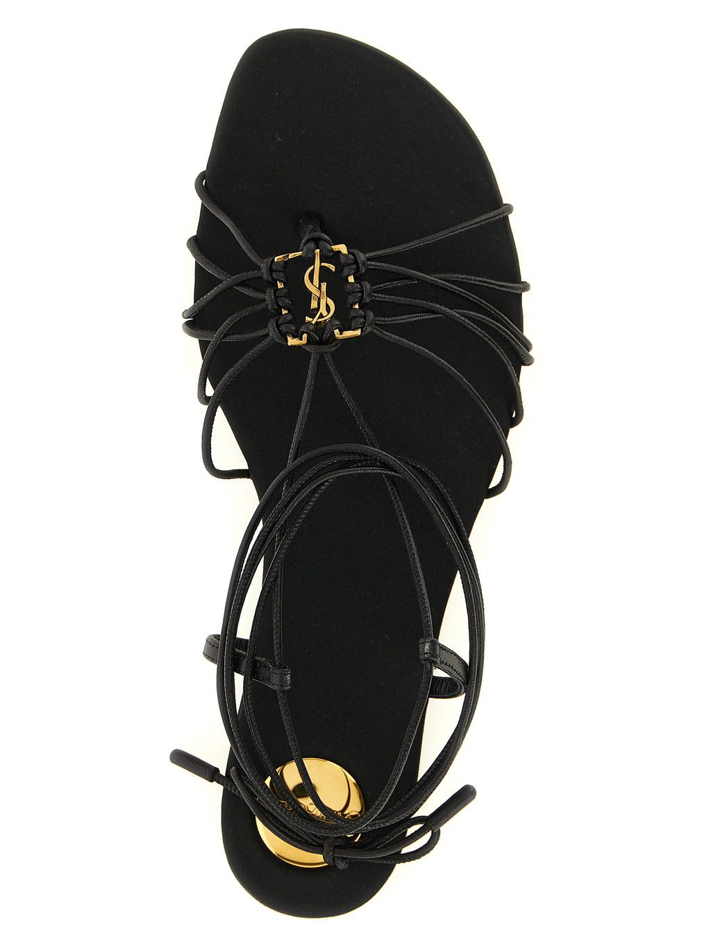 Sandales plates en cuir d'agneau noir de Saint Laurent, vue détaillée du dessus montrant le design élégant et la finition soignée.