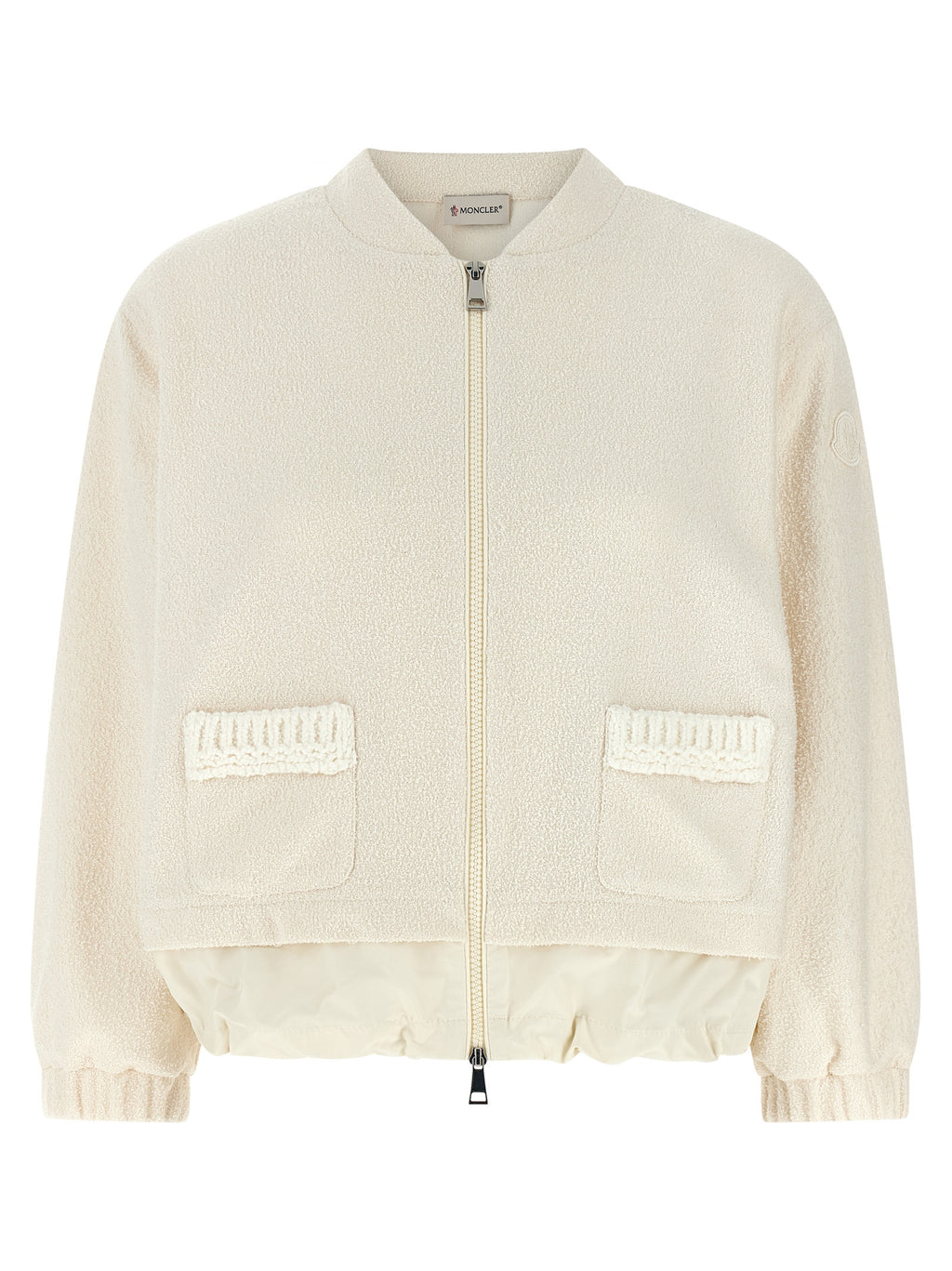 Cardigan blanc en polyester de la marque Moncler, doux et élégant, porté sur un mannequin.