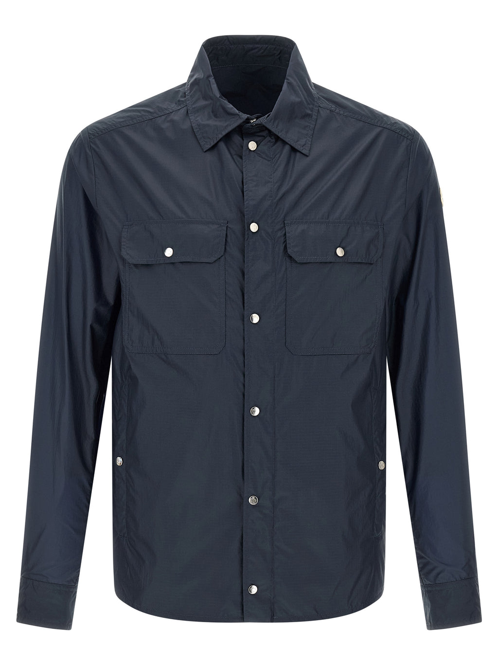 Blouse en polyamide bleue Moncler avec détails élégants, visible sur cette image.