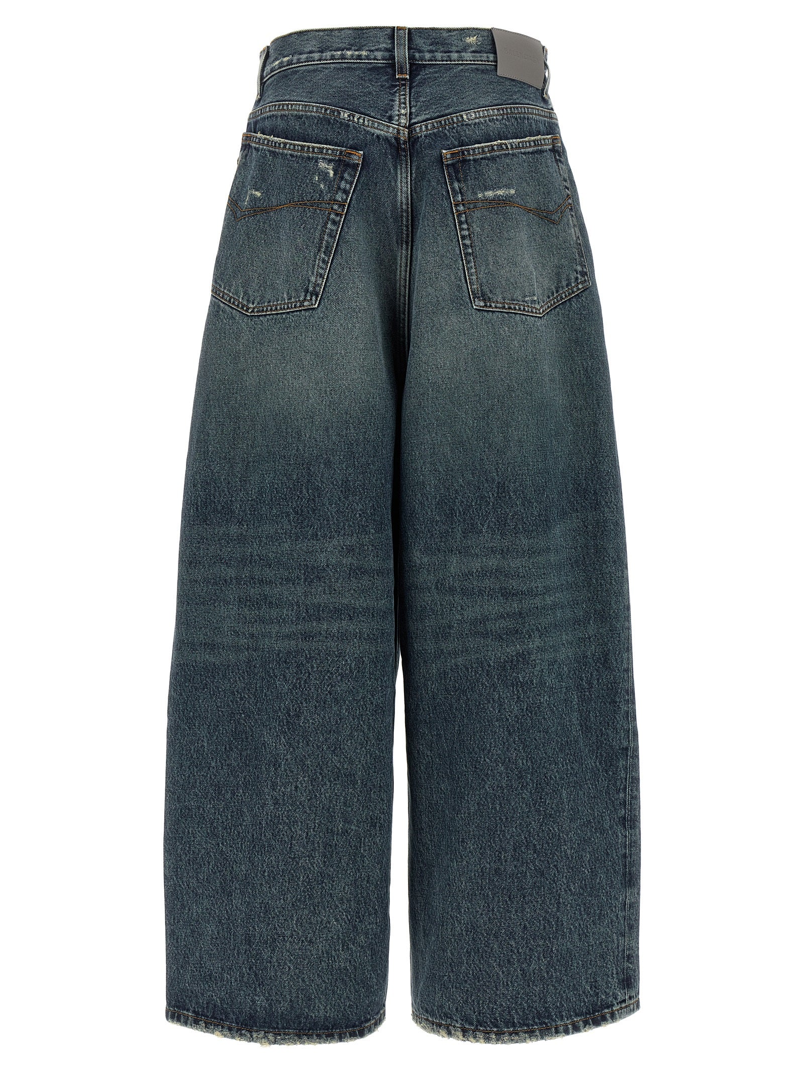 Jeans bleu en coton de coupe décontractée de la marque Balenciaga, visibles avec détails et texture du tissu.