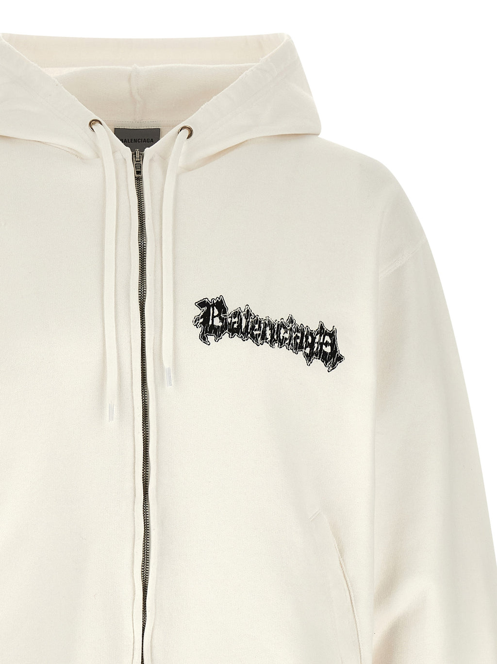 Sweat-shirt blanc en coton de Balenciaga, style décontracté, avec logo discret, porté sur mannequin.