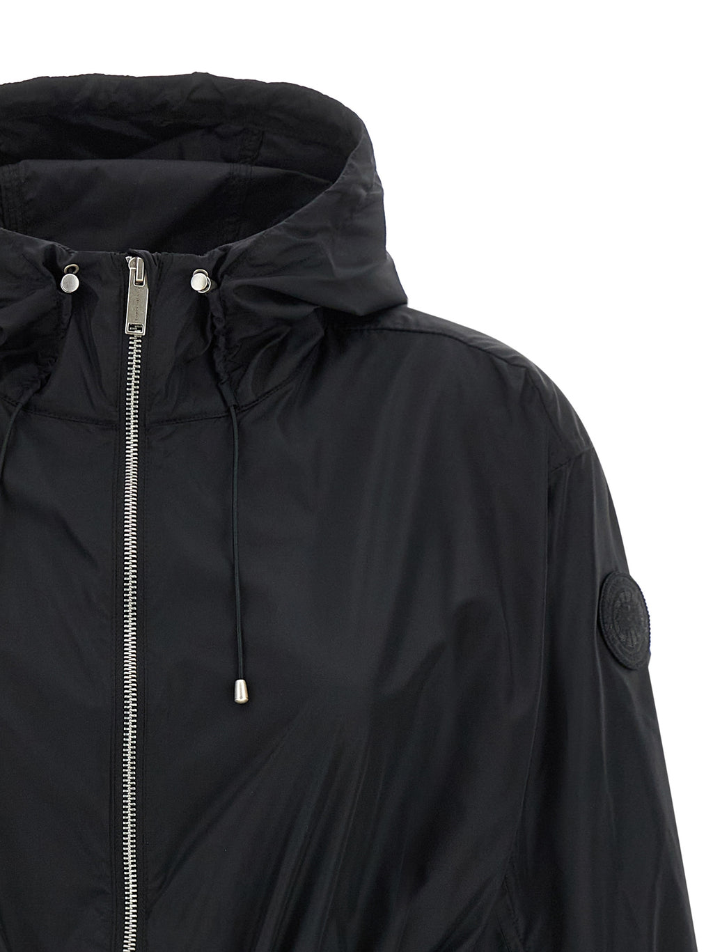 Doudoune Canada Goose noire en polyamide, style parka, avec capuche et fermeture éclair visible.