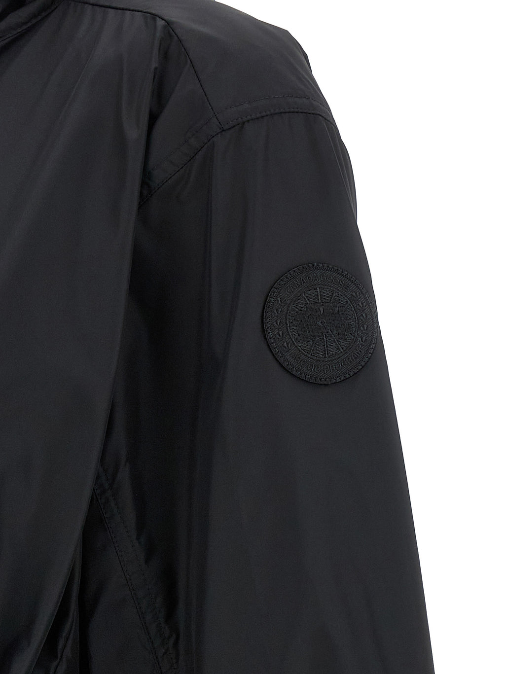 Veste parka noire en polyamide de Canada Goose, coupe-vent et chaud, avec capuche et fermeture zippée.