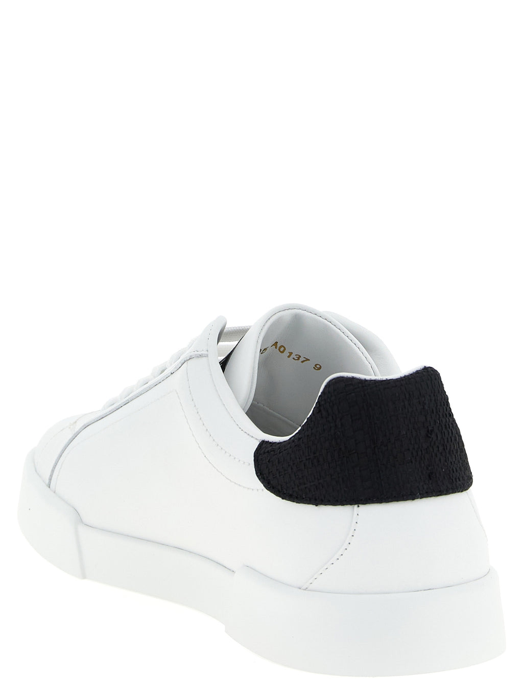 Chaussures sneakers basses en cuir bicolore Dolce & Gabbana pour hommes, avec design élégant et détails modernes.
