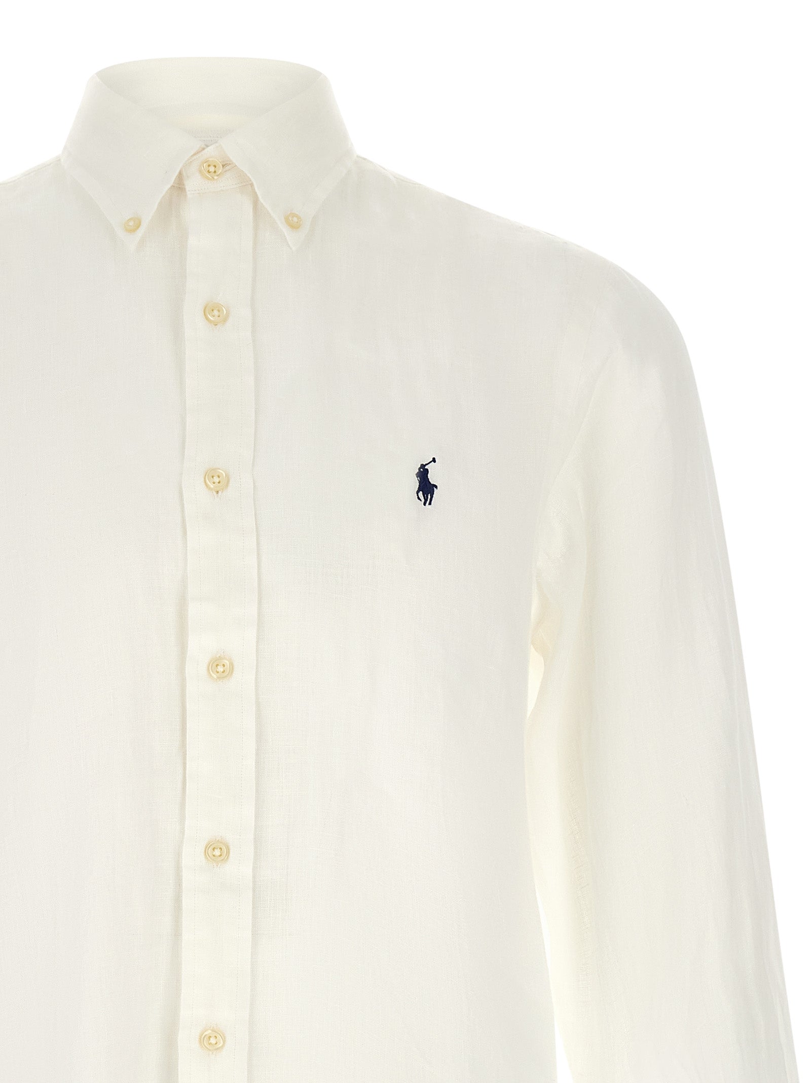 Blouse en lin blanche Polo Ralph Lauren, coupe élégante avec col et boutons, portée décontractée ou chic.