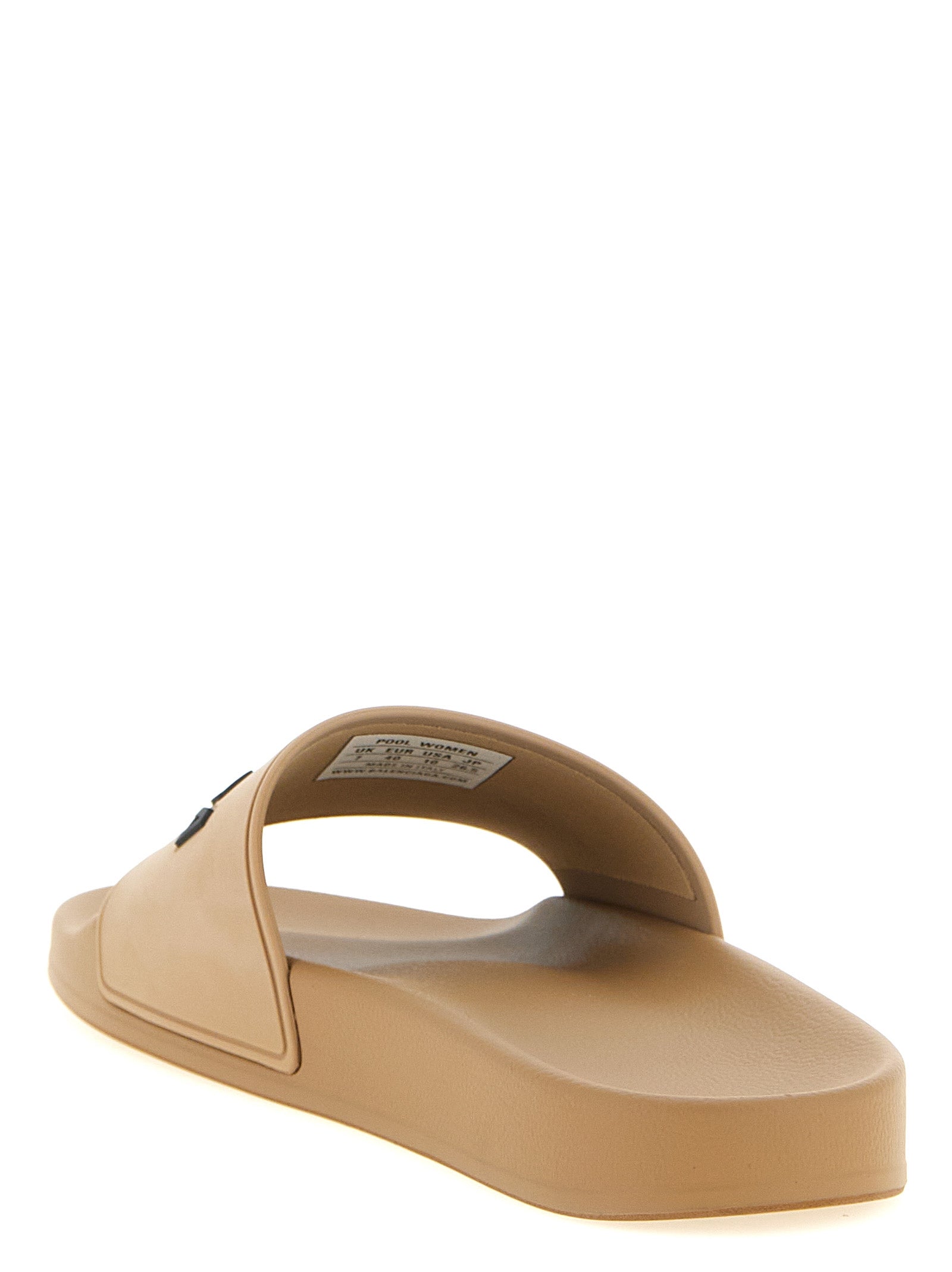 Sandales en plastique beige Balenciaga avec design moderne et semelle plate, parfaites pour un style décontracté.