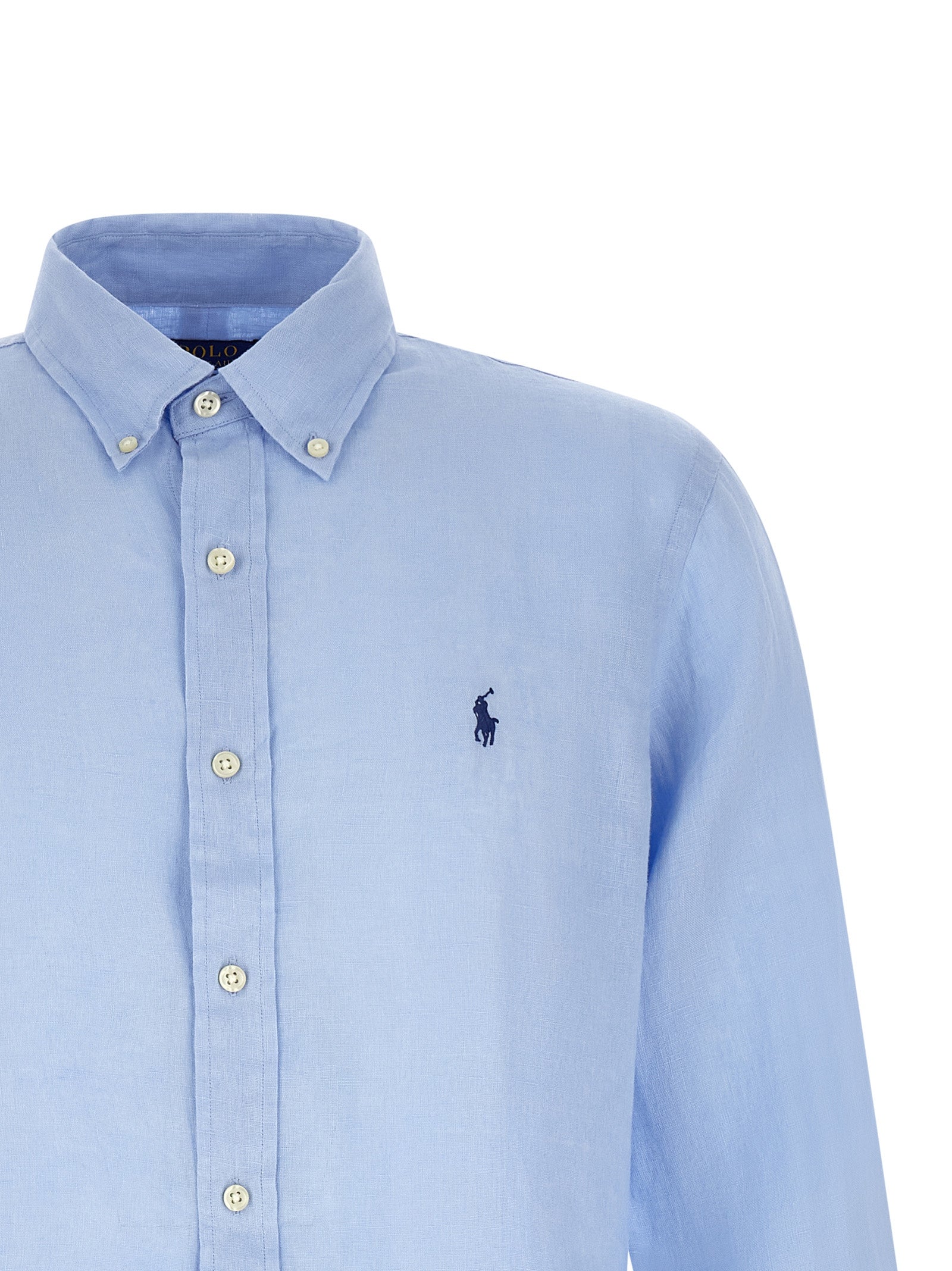 Chemise en lin bleu Polo Ralph Lauren, avec col et manches longues, visible sur une mannequin.