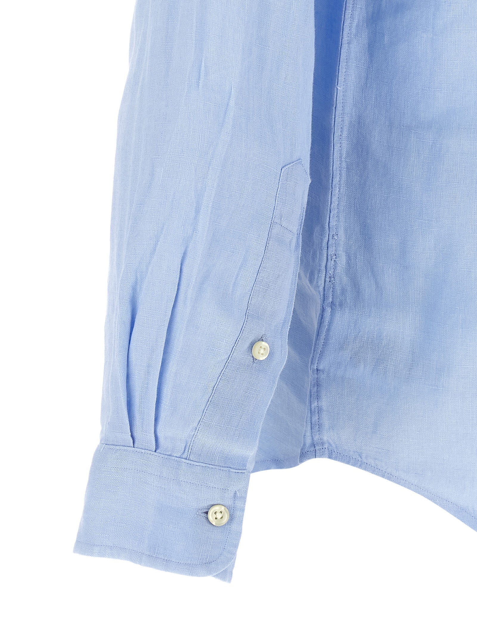 Blouse en lin bleu Polo Ralph Lauren avec col classique et manches longues, vue de face.