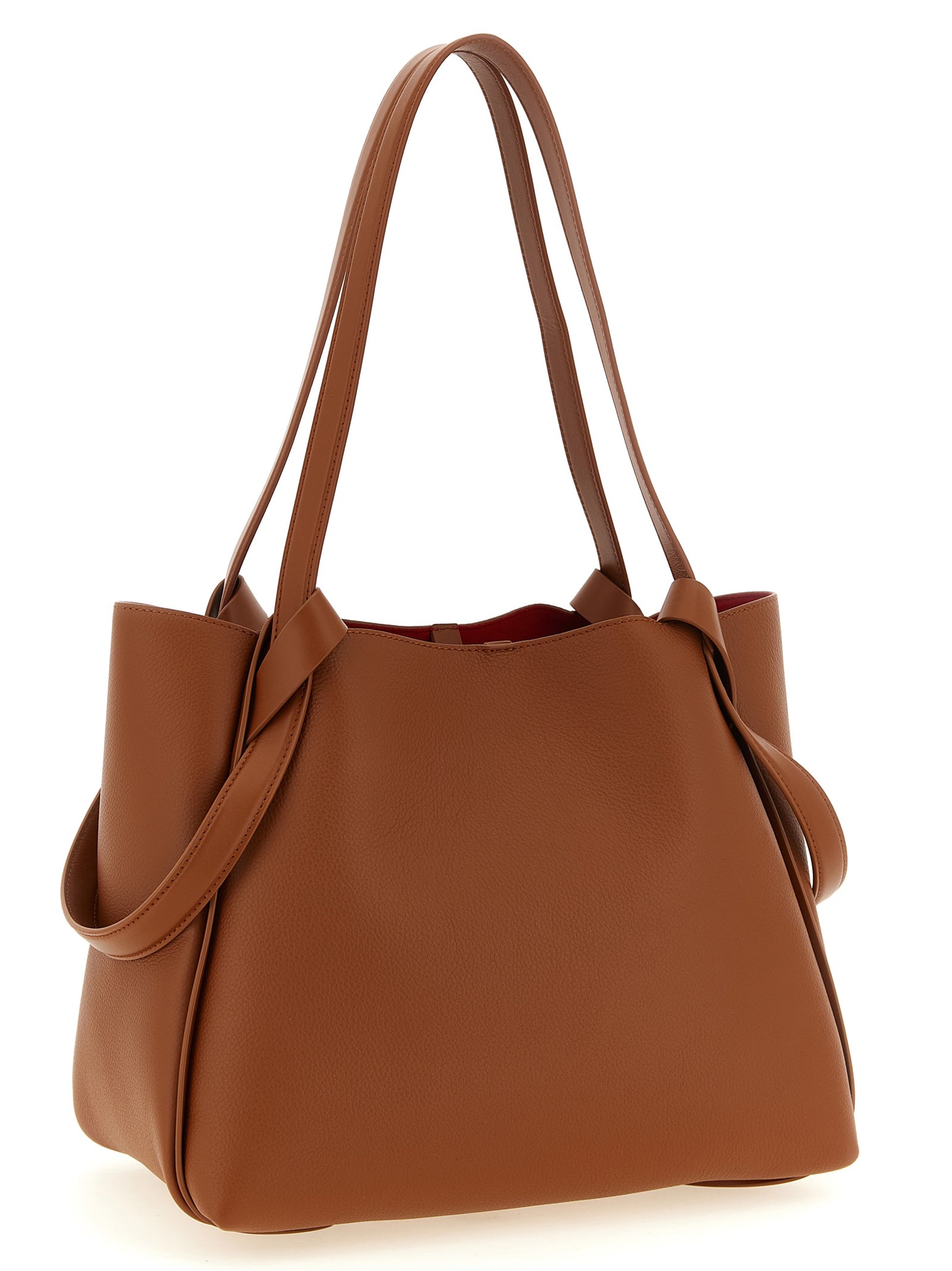 Sac à main Christian Louboutin en cuir de veau marron, grand modèle avec poignées et détails élégants.