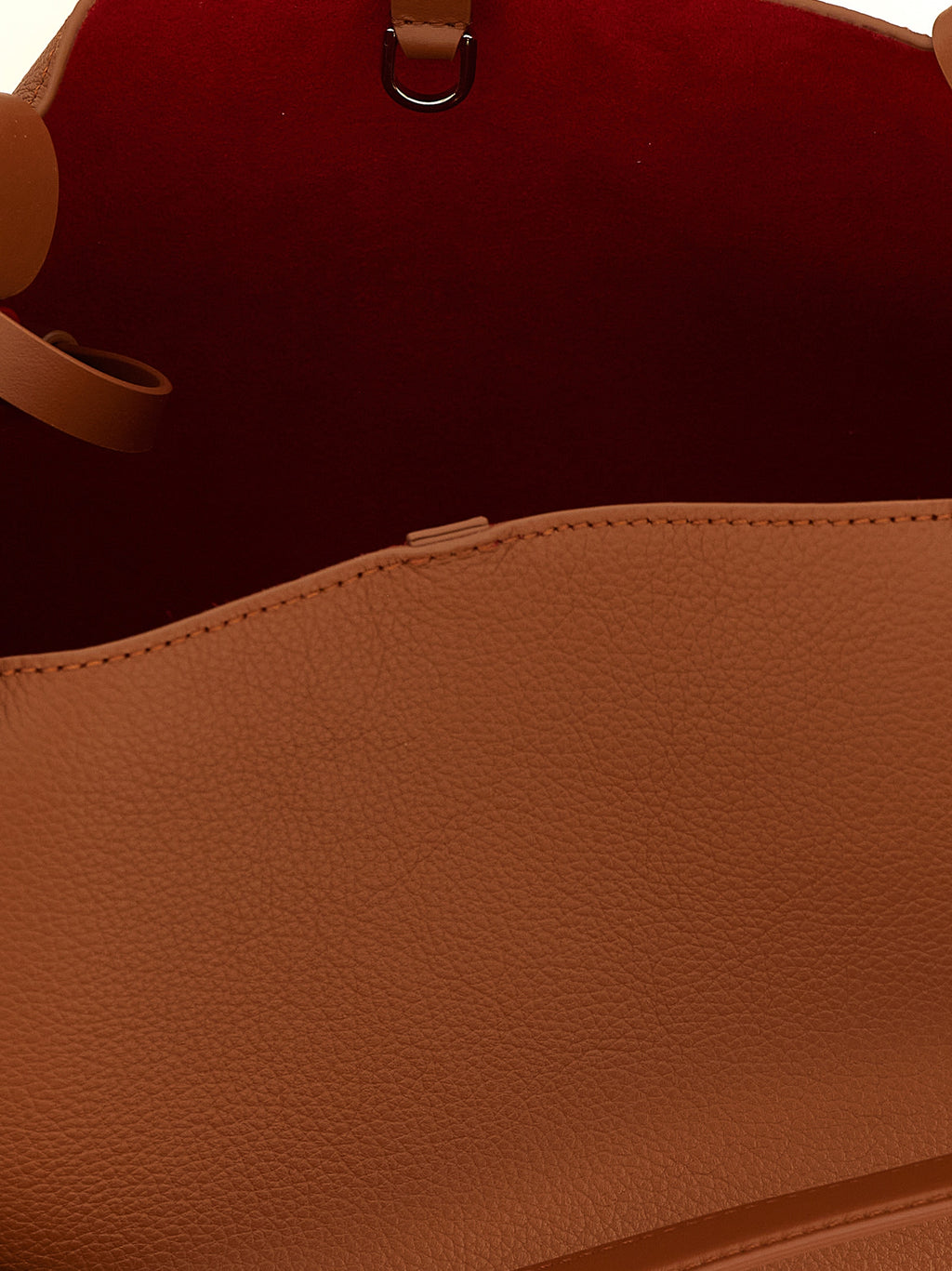 Sac à main Christian Louboutin en cuir de veau marron avec poignées et détails élégants, vue de face.