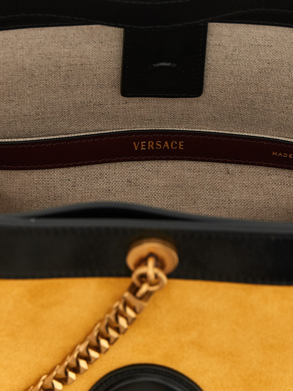 Sac à bandoulière Versace Bicolor en cuir de veau, design élégant avec détails colorés, parfait pour un style sophistiqué.