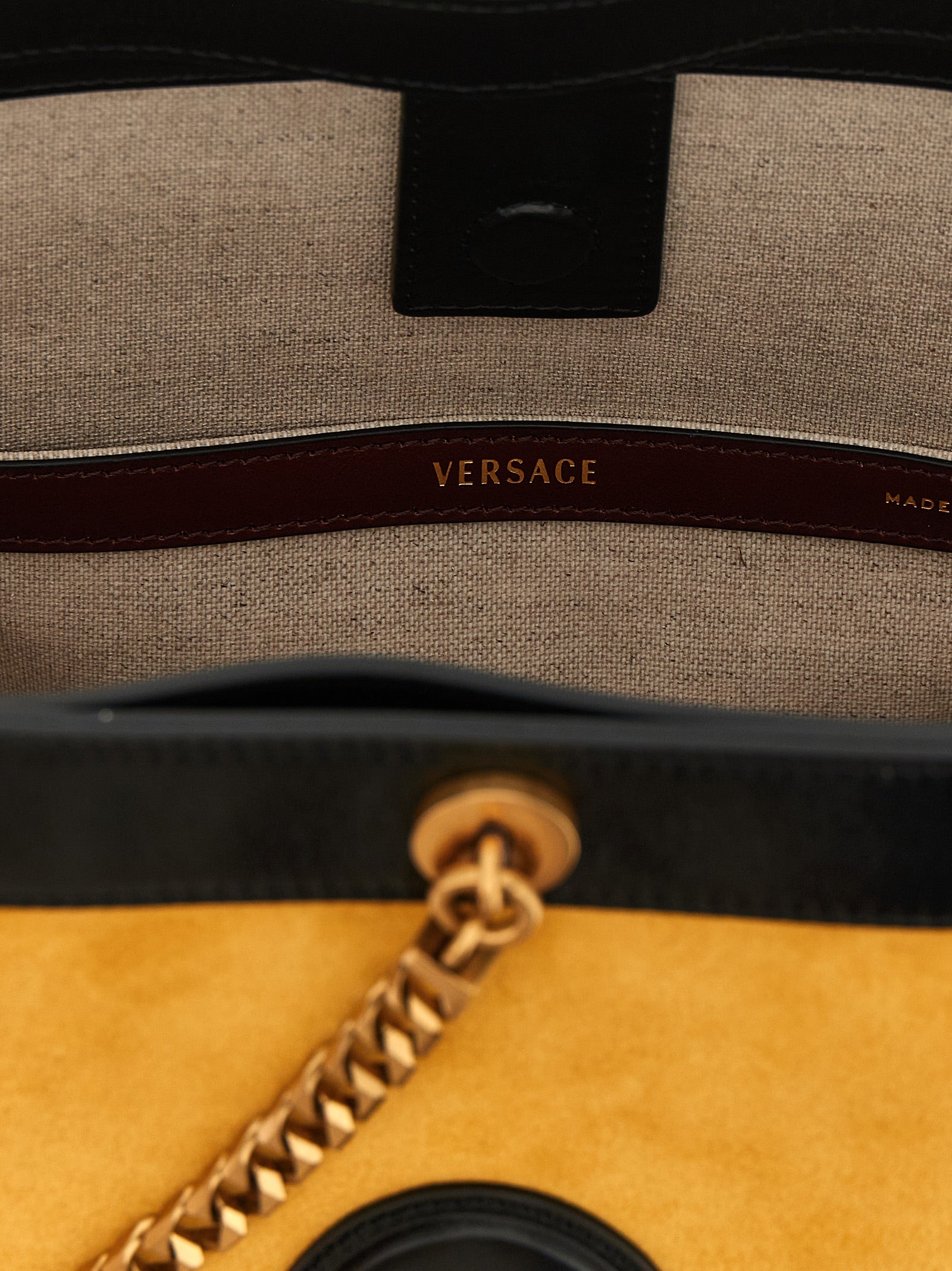 Sac à bandoulière Versace Bicolor en cuir de veau, design élégant avec détails colorés, parfait pour un style sophistiqué.