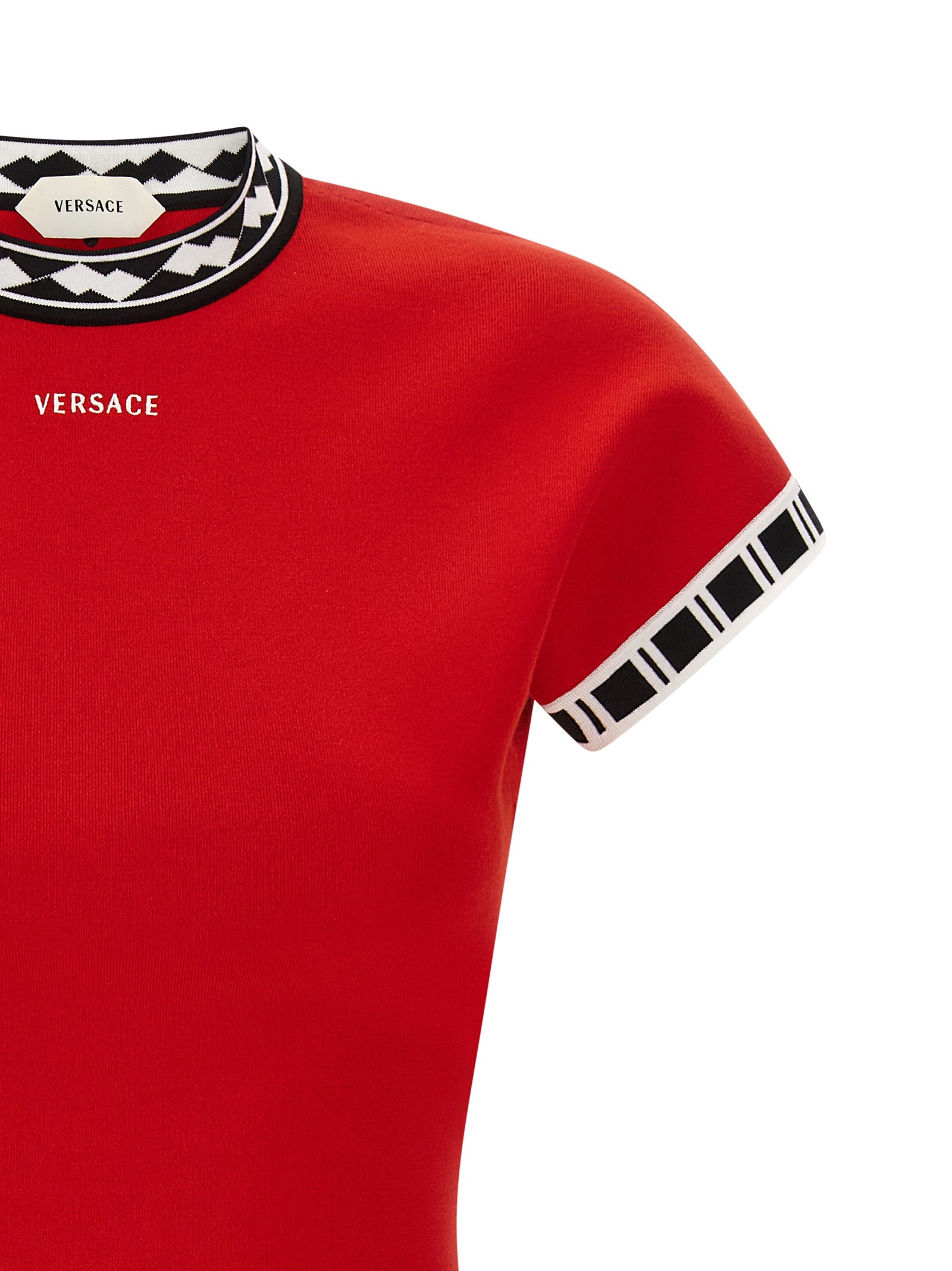 Robe courte en coton multicolore de Versace, avec motif vibrant et design élégant, portée par un mannequin.