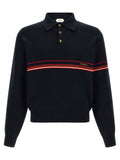 Chemise polo en coton bleu de la marque Versace avec logo emblématique sur la poitrine, vue de face.