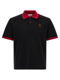 Chemise polo noire en coton de la marque Versace, avec logo emblématique, portée sur un mannequin.