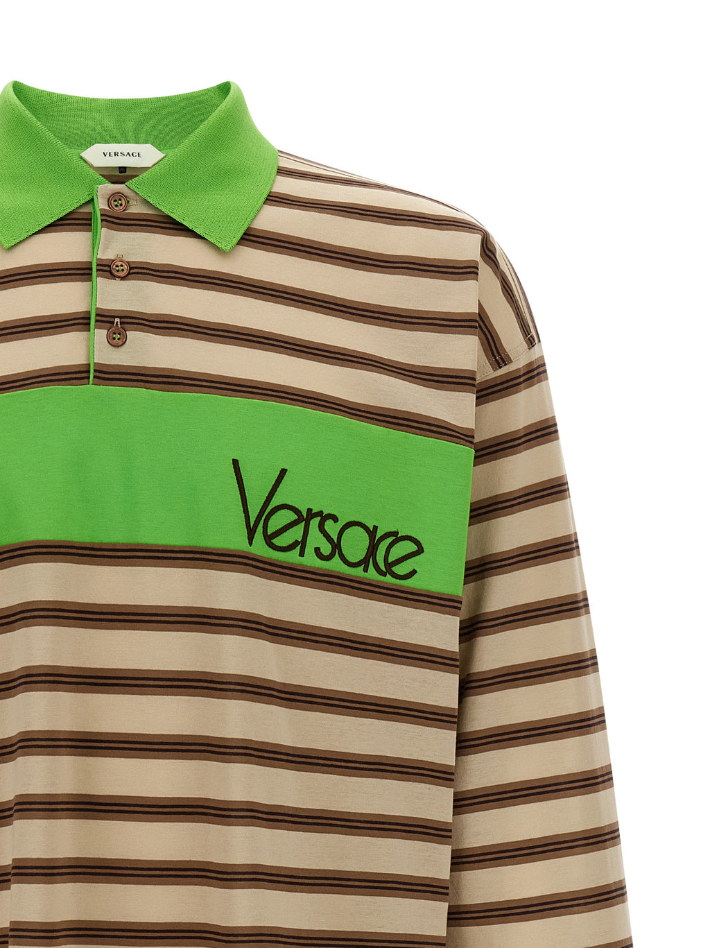 Chemise polo en coton multicolore de Versace, vue de face avec logo et détails colorés, pour un style élégant et décontracté.