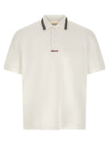 Chemise polo blanche en coton de la marque Versace, avec logo distinctif et col classique, vue de face.