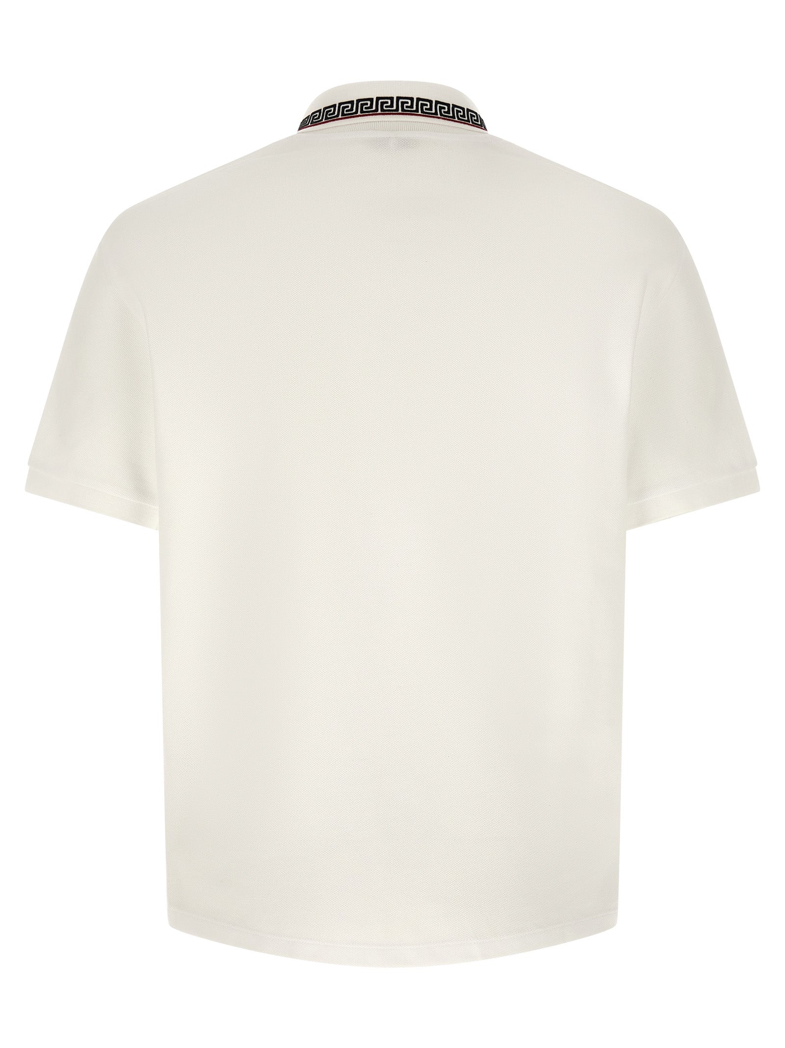 Chemise polo blanche en coton de la marque Versace, vue de face avec col et boutons visibles.