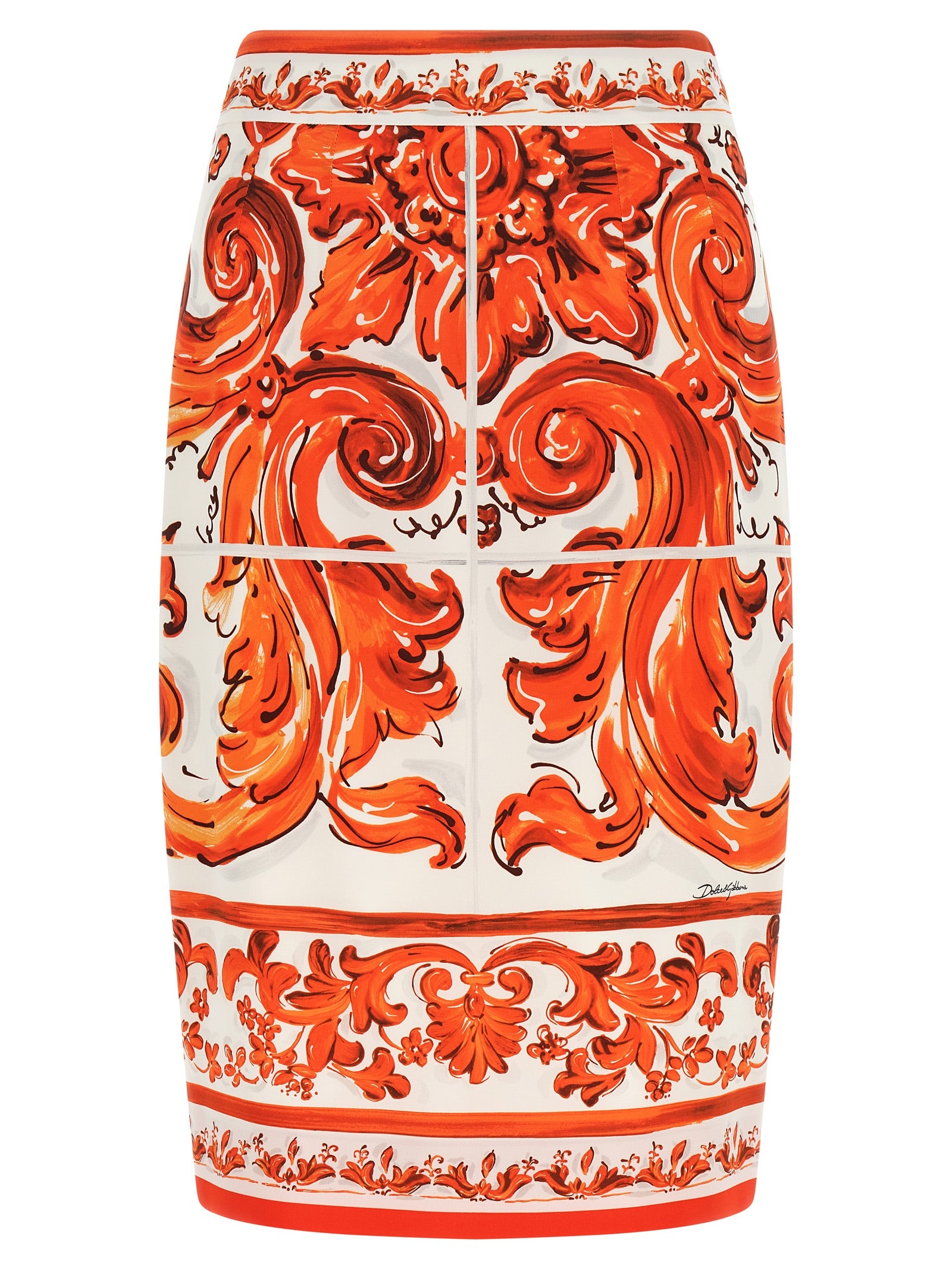 Jupe midi en soie orange de Dolce & Gabbana, élégante et fluide, portée avec un style sophistiqué et moderne.