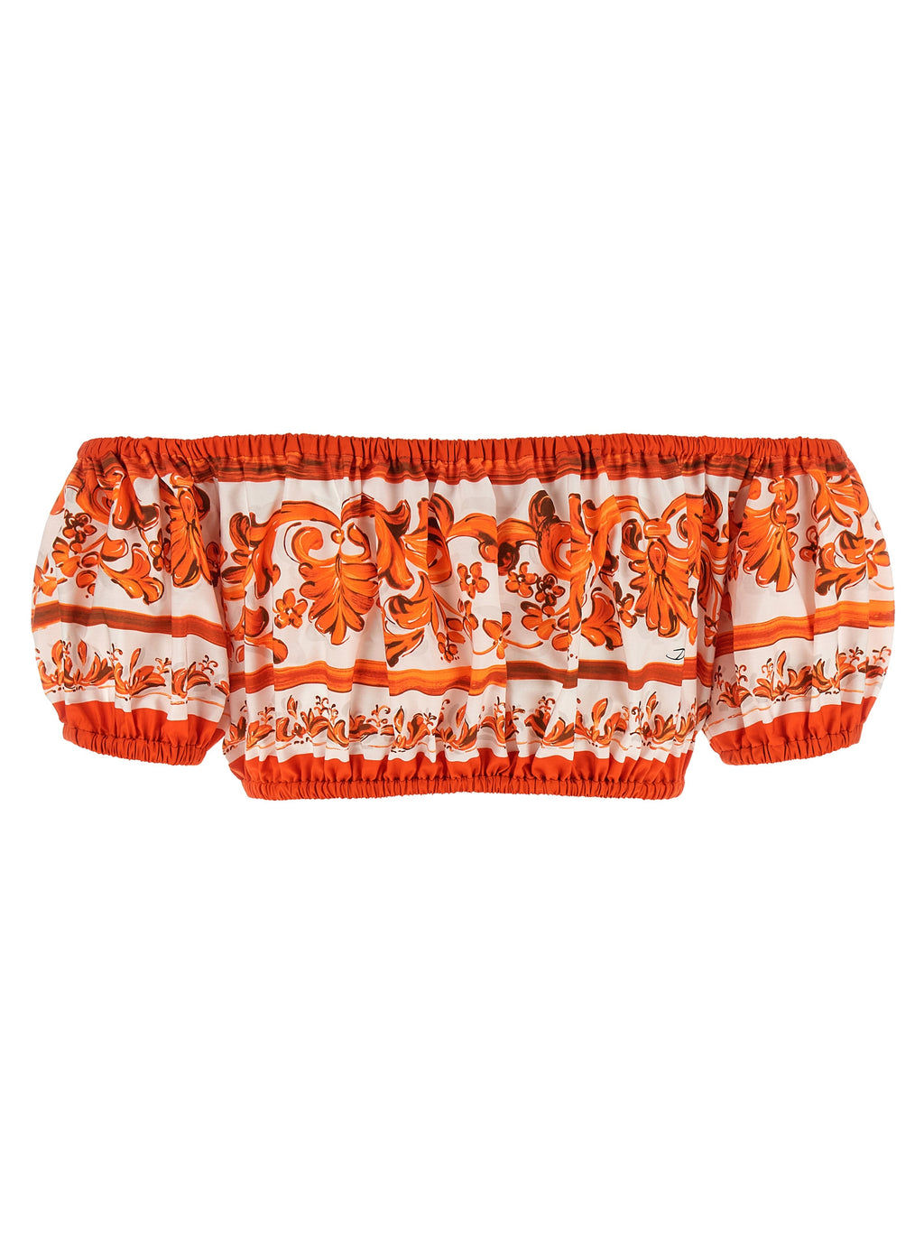 Chemisier en coton orange Dolce & Gabbana avec détails élégants, porté dans une tenue chic et raffinée.