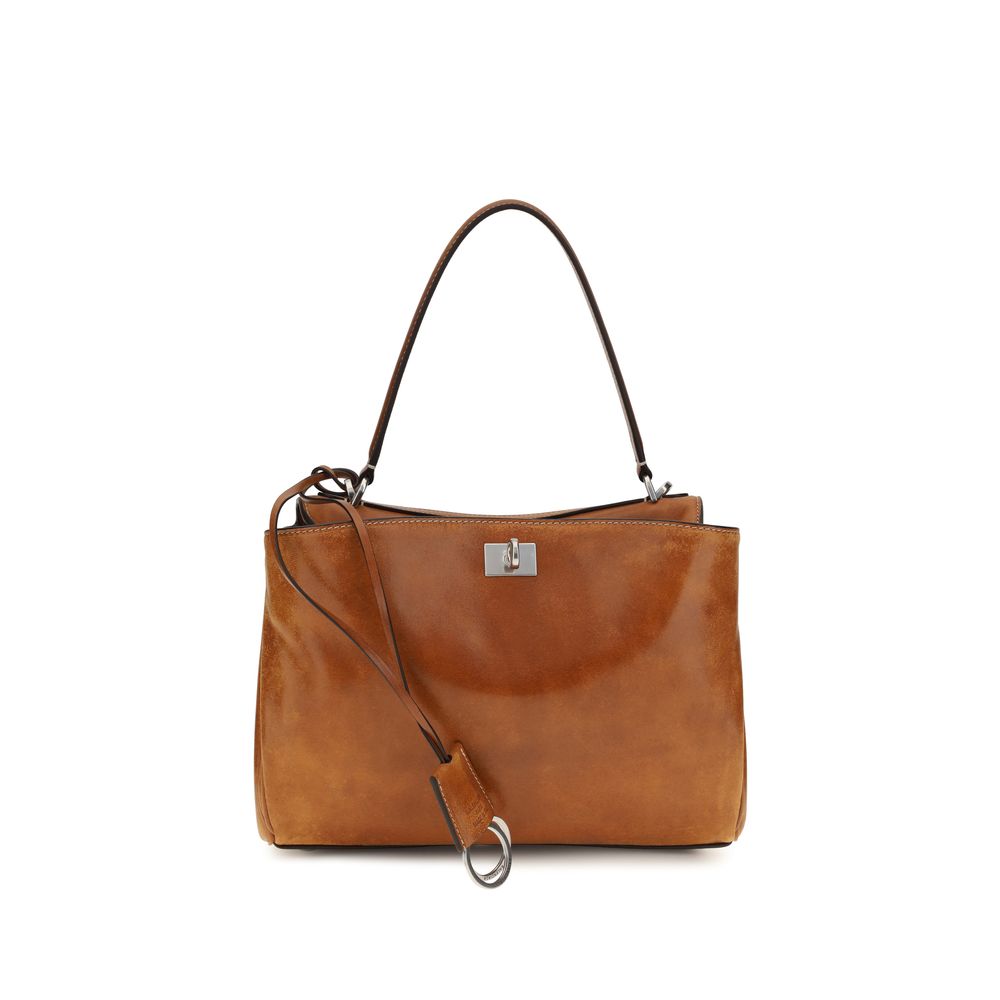Sac à main Balenciaga en cuir d'agneau marron avec détails en or, élégant et sophistiqué, vue de face.