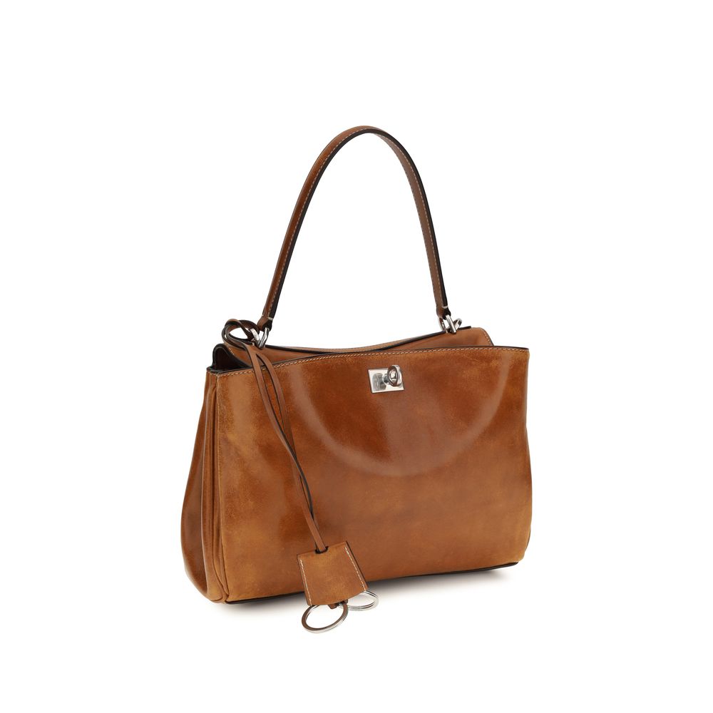 Sac à main Balenciaga en cuir de mouton brun Ovis Aries avec détails élégants et finition sophistiquée.