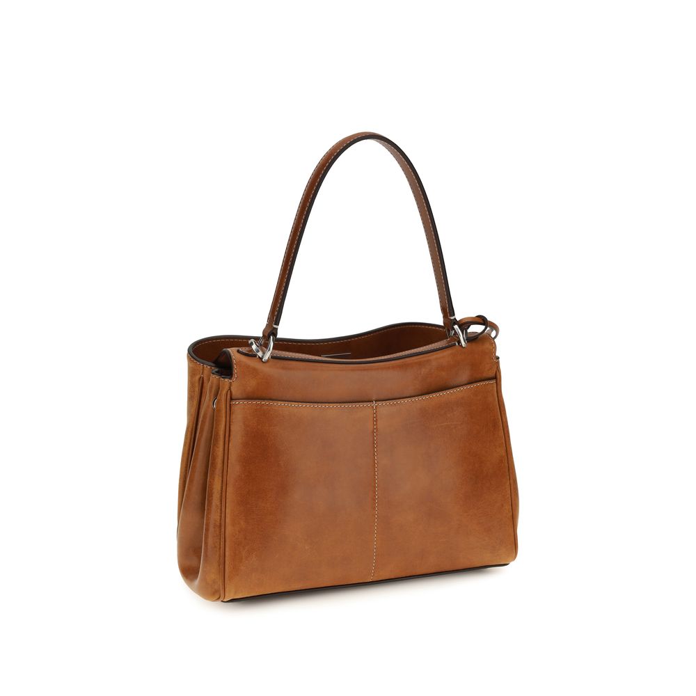 Sac à main Balenciaga en cuir d'agneau marron avec logo gravé, vue de face, détails de la texture du cuir et poignée.