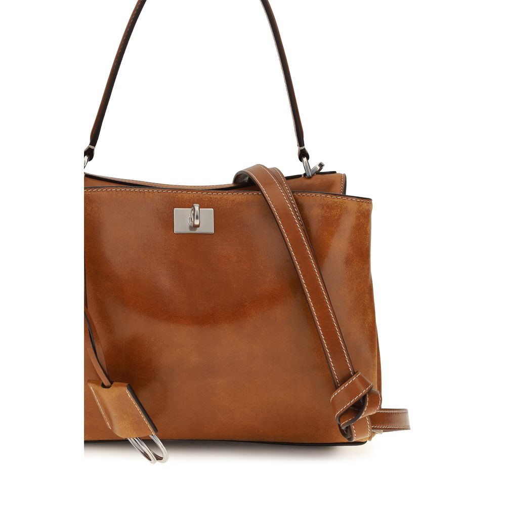 Sac à main Balenciaga en cuir d'agneau marron avec détails élégants, vue de face sur fond neutre.