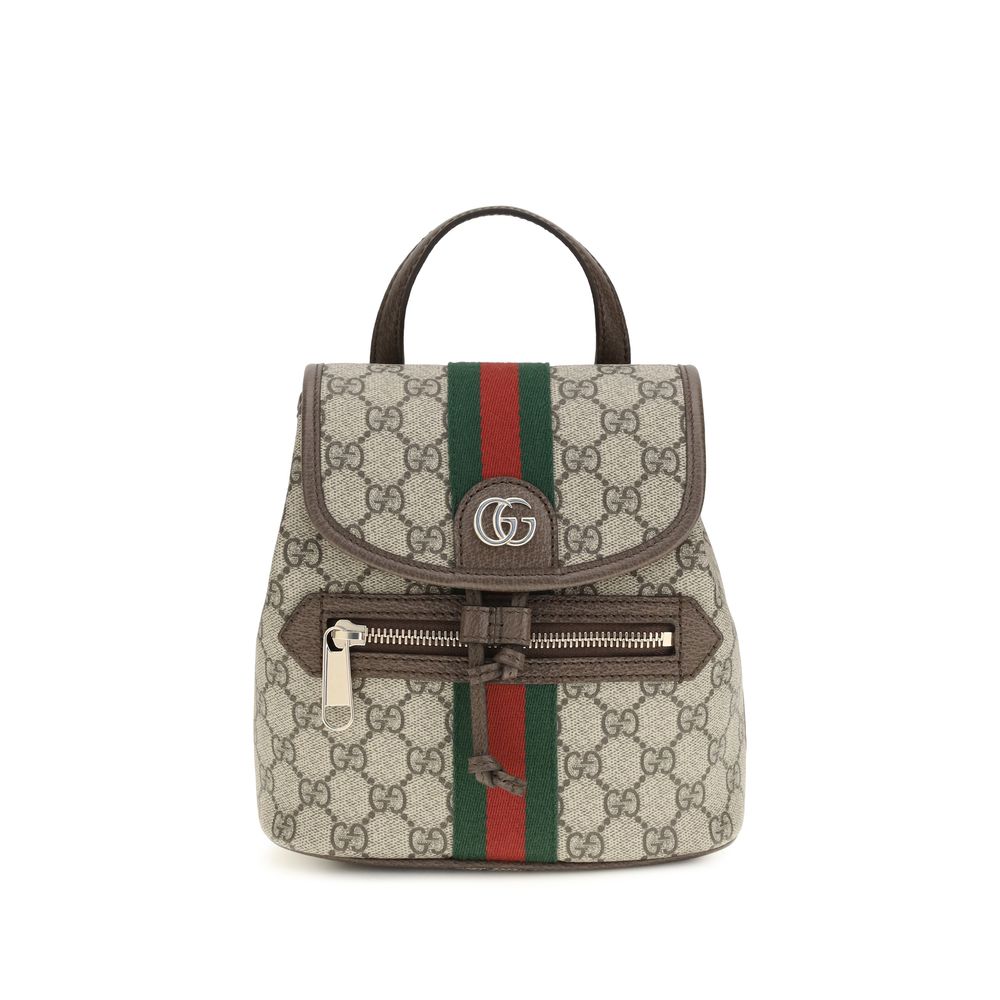 Sac à dos en tissu beige Gucci, avec détails élégants, idéal pour un style sophistiqué et pratique.