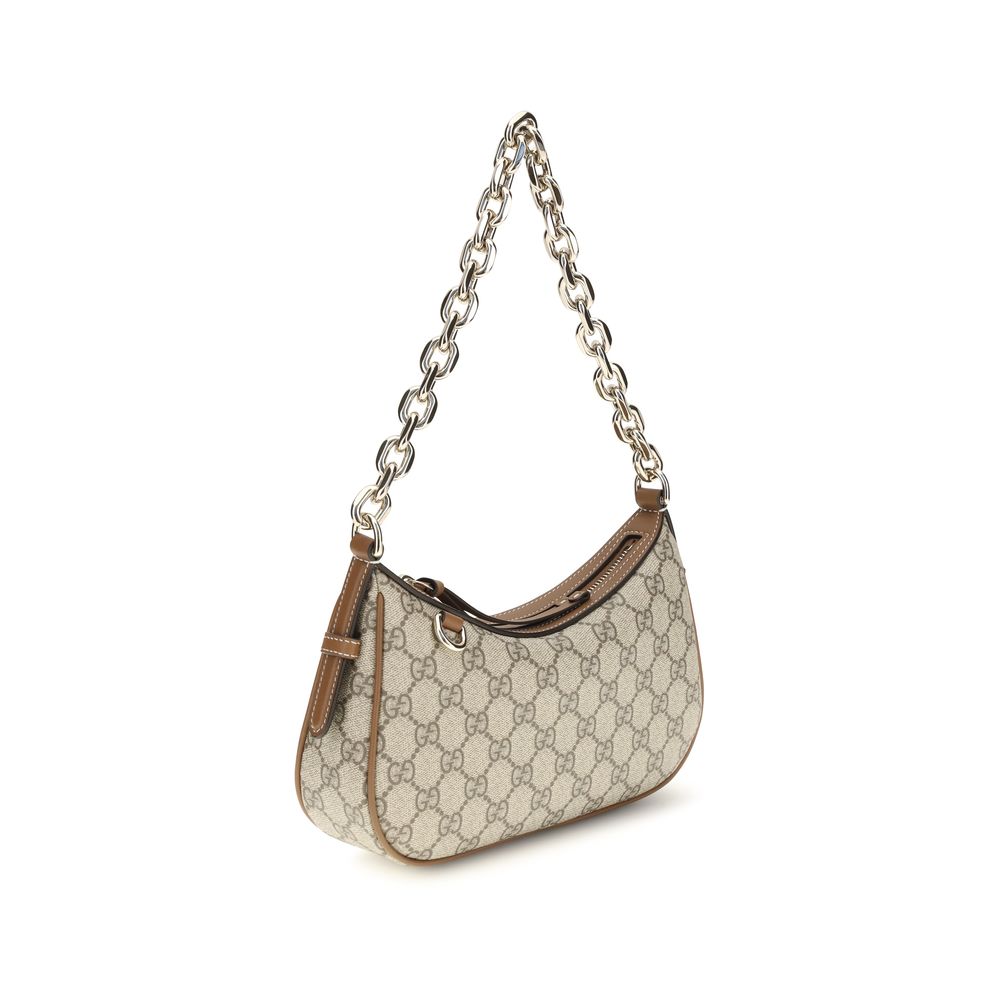 Sac à main en tissu beige Gucci, élégant et spacieux, avec détails raffinés visibles sur l'image.