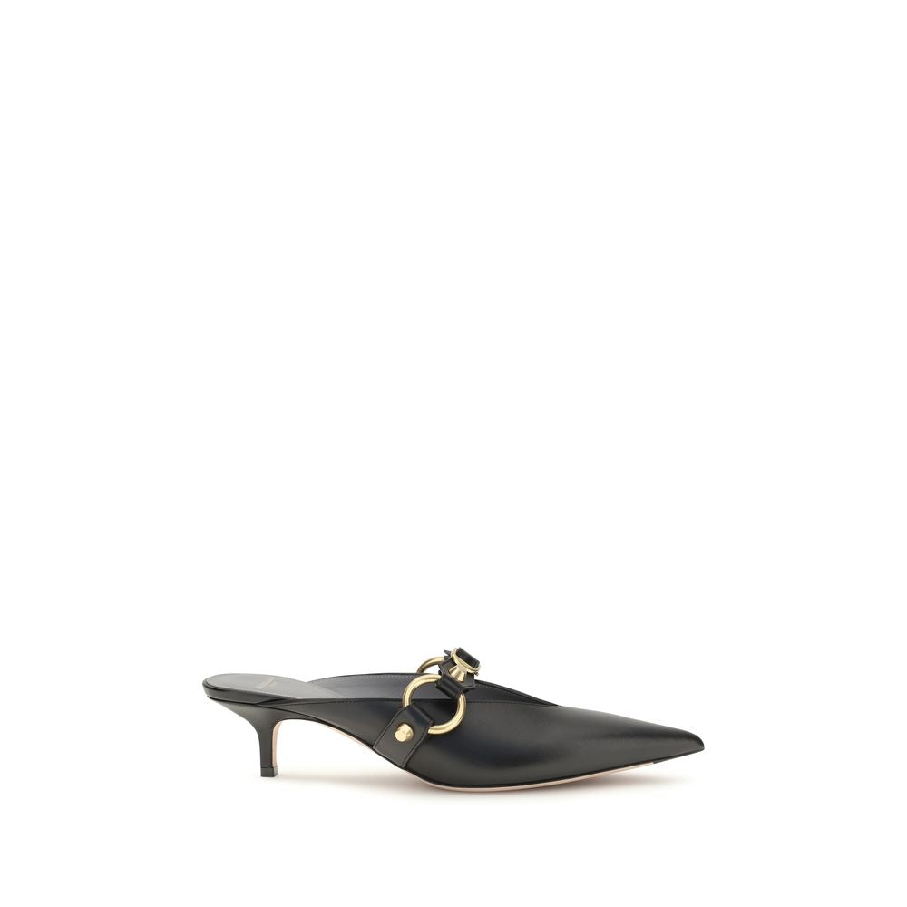 Mules Balenciaga en cuir de veau noir Bos Taurus, élégantes et sophistiquées, vues de côté sur fond neutre.