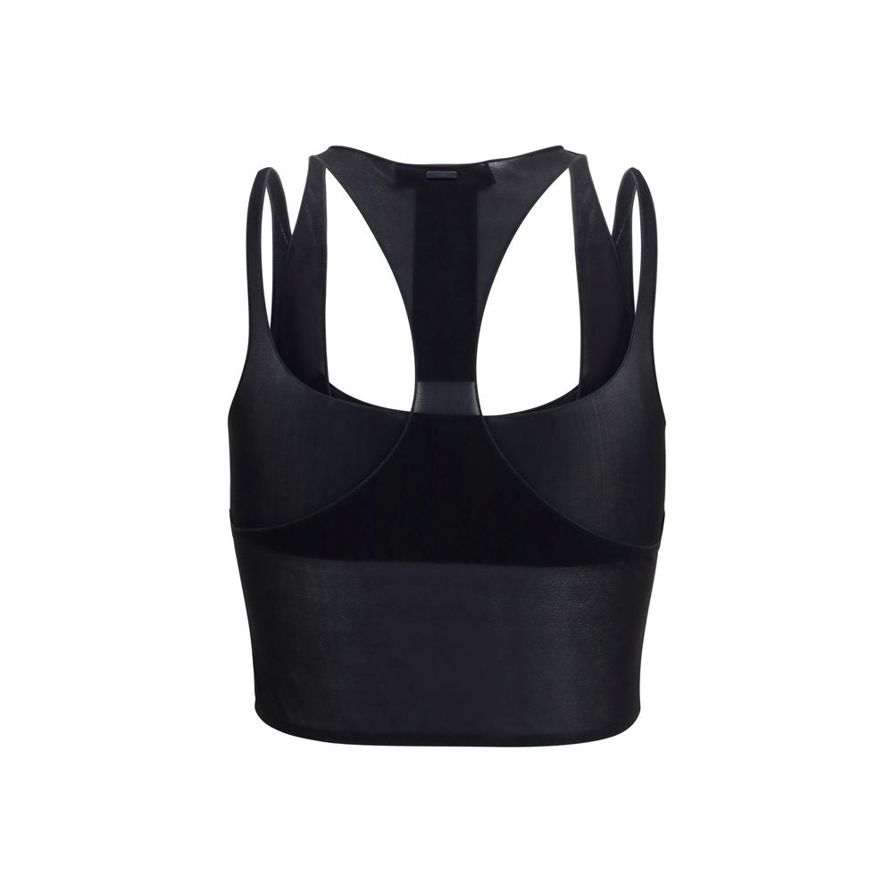 Blouse en viscose noire Gucci avec détails élégants, portée sur un mannequin dans une image de mode.