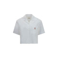 Chemise blanche en coton de la marque Versace, avec col classique et boutons élégants, portée sur mannequin.