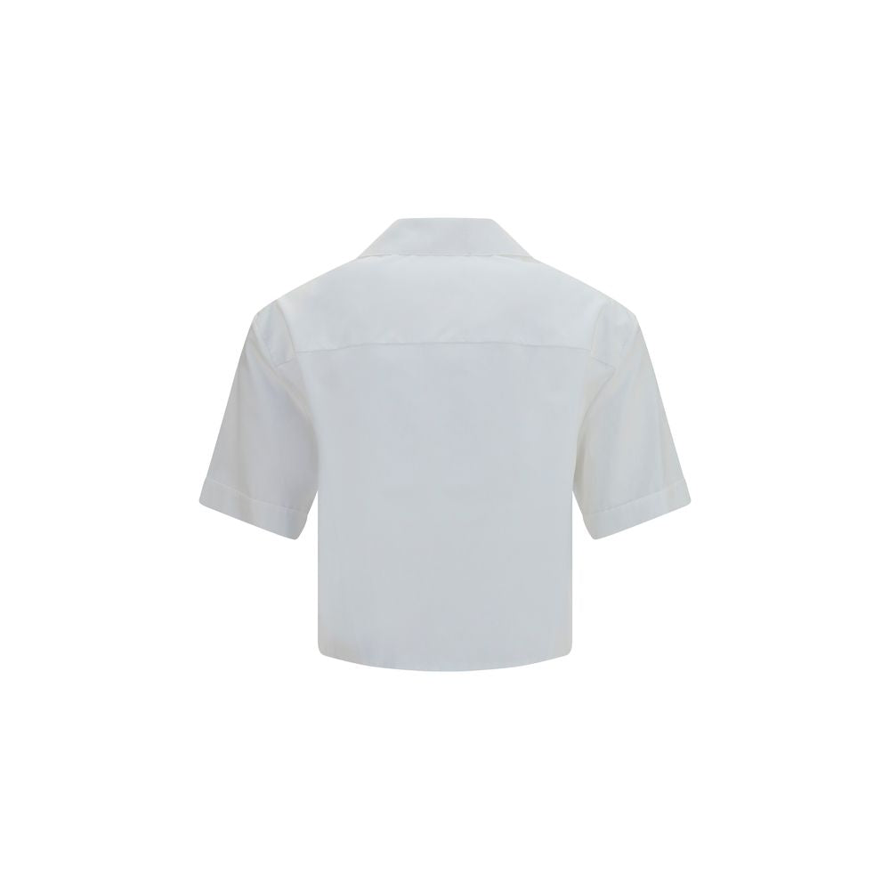 Chemise blanche en coton de la marque Versace, élégante et classique, avec col et boutons visibles sur l'image.