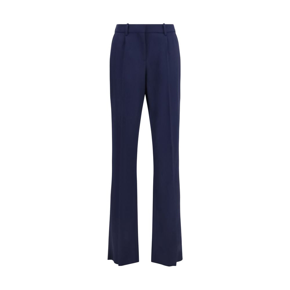 Pantalon en laine bleue Balenciaga Oves Aries, coupe décontractée, détails modernes, porté sur mannequin.