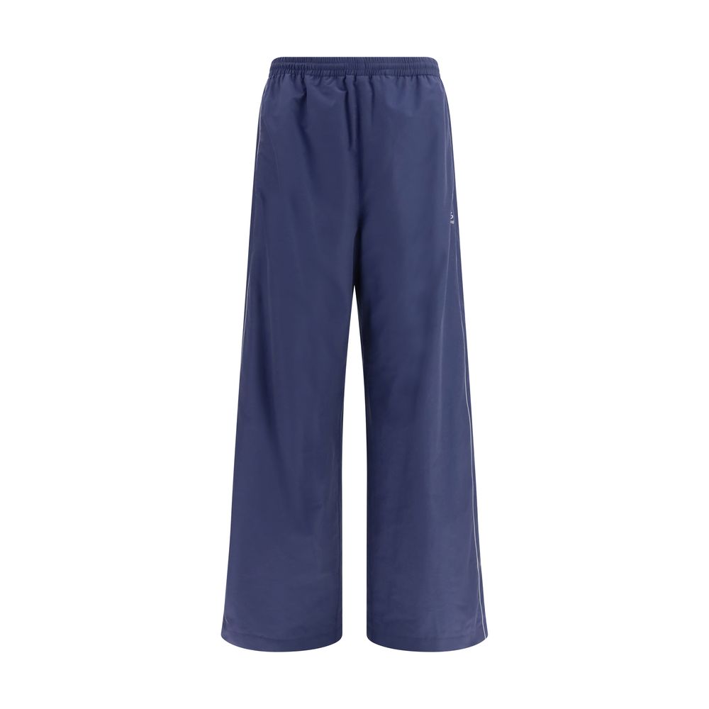 Pantalons athlétiques en coton bleu de la marque Balenciaga, coupe décontractée et design moderne visible sur l'image.