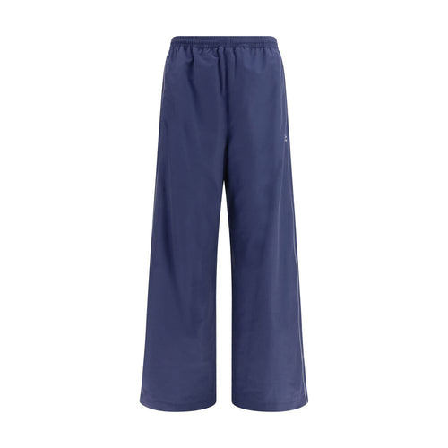Pantalons athlétiques en coton bleu de la marque Balenciaga, coupe décontractée et design moderne visible sur l'image.