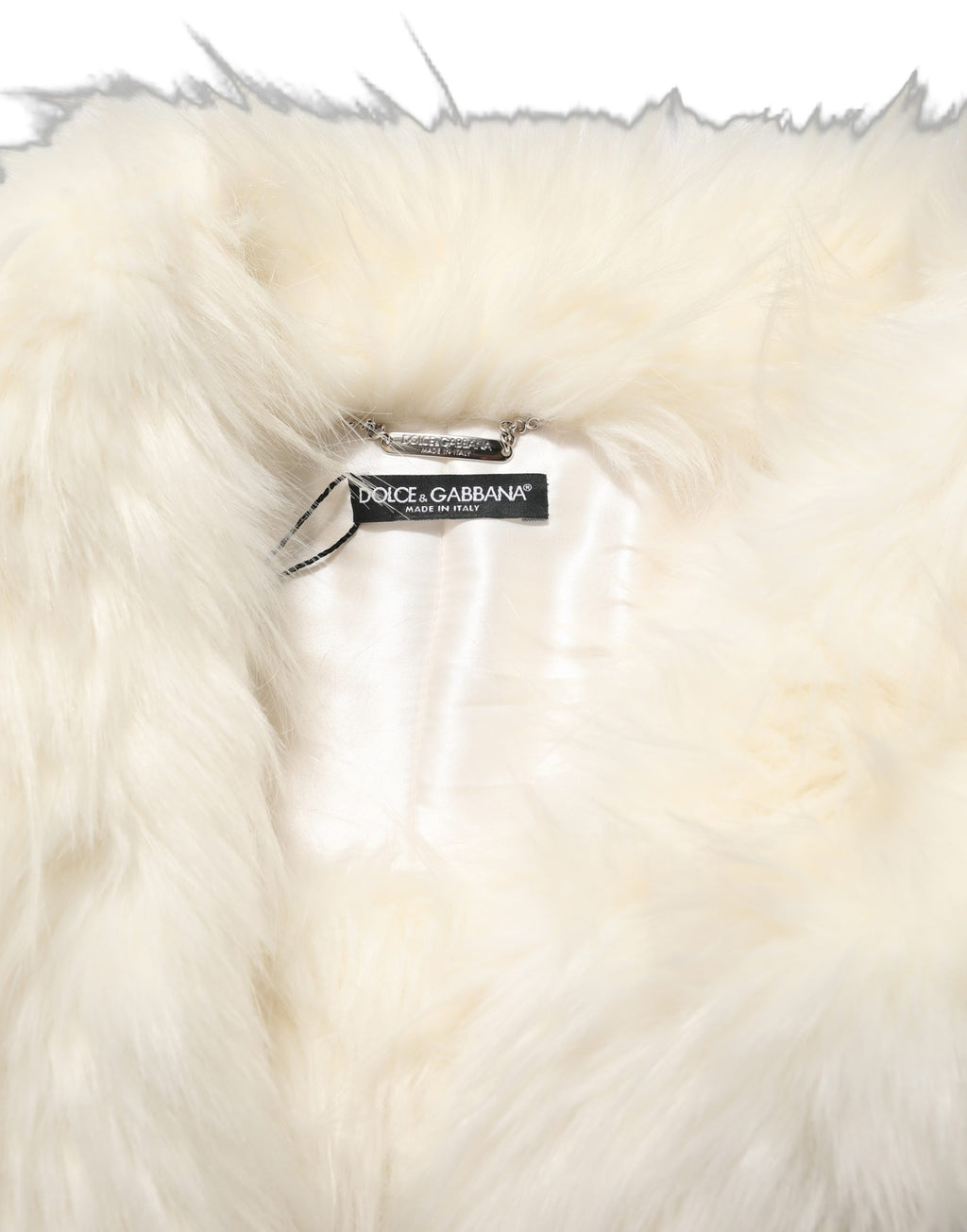 Manteau long à manches longues en fausse fourrure blanche de Dolce & Gabbana, élégant et chaud.