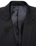 Costume homme noir en laine Dolce & Gabbana, costume deux pièces ajusté et élégant pour occasions formelles.