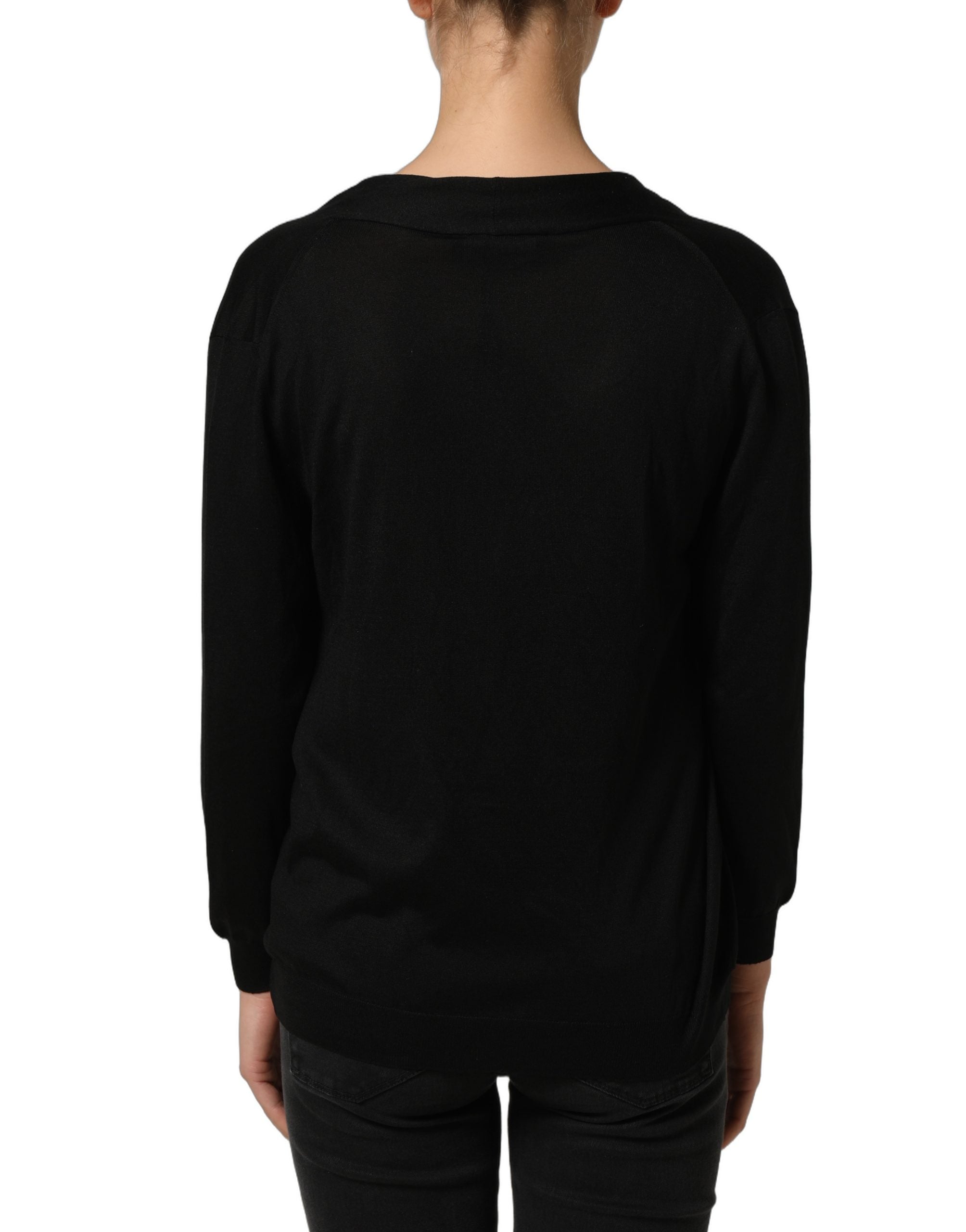 Blouse longue en soie noire Dolce & Gabbana avec manches longues et drapé, élégante et sophistiquée.