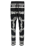 Pantalons décontractés en soie bicolore Dolce & Gabbana avec coupe élégante et détails modernes, vue de face sur fond neutre.