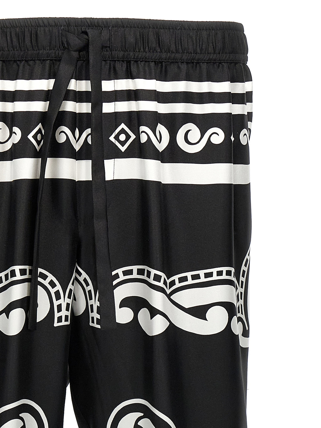 Pantalon décontracté en soie bicolore de Dolce & Gabbana, coupe élégante et tissu fluide, couleur bleu et beige.