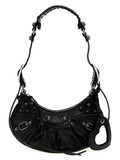 Sac à bandoulière en cuir d'agneau noir de Balenciaga, design élégant avec détails modernes et finition de haute qualité.