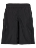 Shorts bermuda noirs en polyester de la marque Givenchy, vue de face, avec coupe élégante et détails modernes.