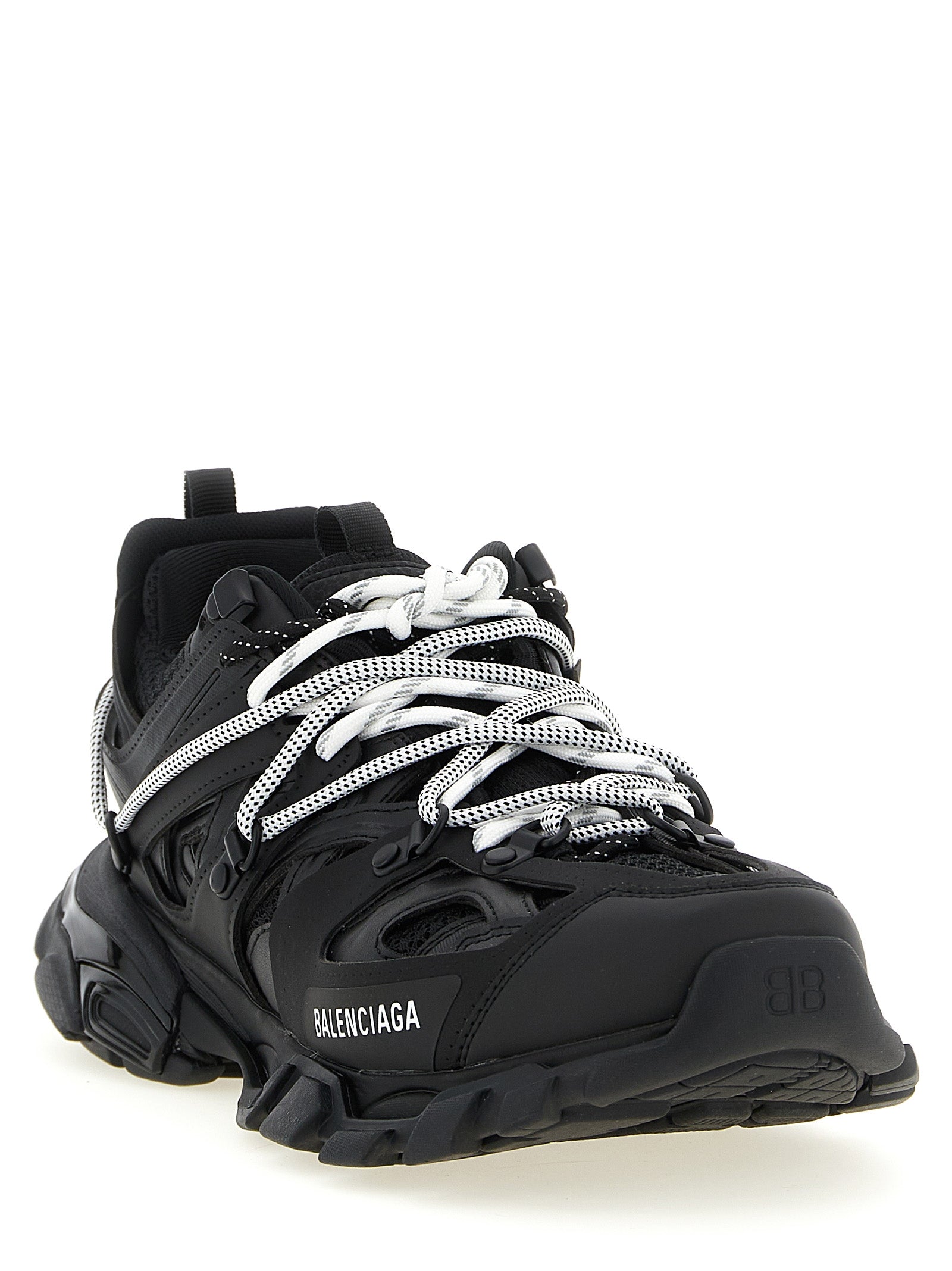 Baskets athlétiques Balenciaga en polyéthylène noir avec semelle blanche, vue de côté.