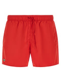 Shorts en polyester multicolores Lacoste, style décontracté, logo Lacoste visible sur la poche, parfait pour l'été.