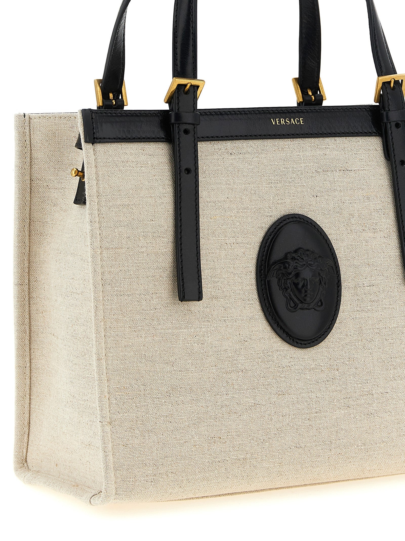 Sac à main en cuir beige Versace, sac tote élégant avec logo distinctif, pour un style sophistiqué et moderne.
