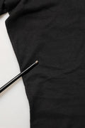T-shirt noir Dolce & Gabbana en coton avec logo DG rond, col rond, vue de face, tissu doux et confortable.